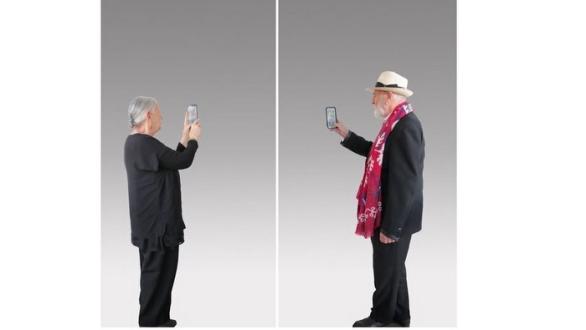 “Maria with Smartphone” (left) and “Autoritratto con smart Phone” (right), 2024, Silkscreen on supermirror stainless steel, each 987 ⁄16 x 493 ⁄16 inches (250 x 125 cm), courtesy of: the artist and CONTINUOUS GALLERY @levygorvydayan @michelangelo_pistoletto