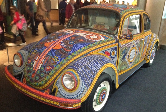 Roll with art. Huichol art, on wheels, in a vocho