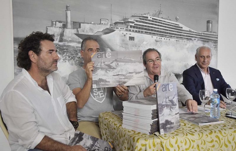 The artist Luis E. Camejo (on the left) attends the presentation