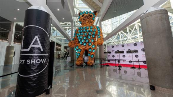 Viktor Freso's 30-foot "Bear Sculpture," commanding attention at the lobby entrance of the LA Art Show.