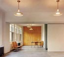  In the studio the slight divisions of plaster and glazed glass can slide to reshape spaces