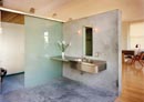 In the house’s main bathroom, the basin area leads straight to the bedroom